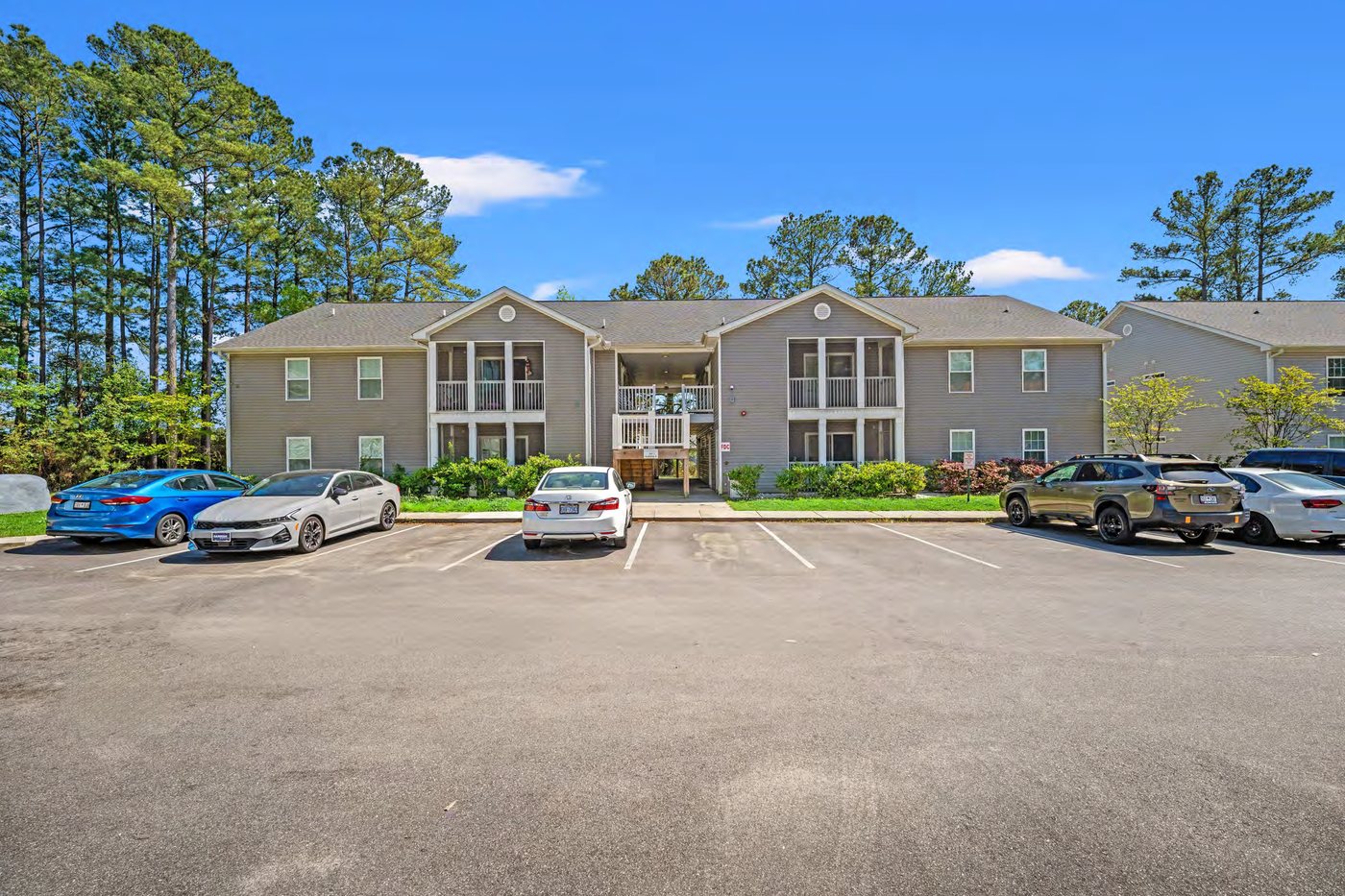 Colonial Gardens apartment building and parking area